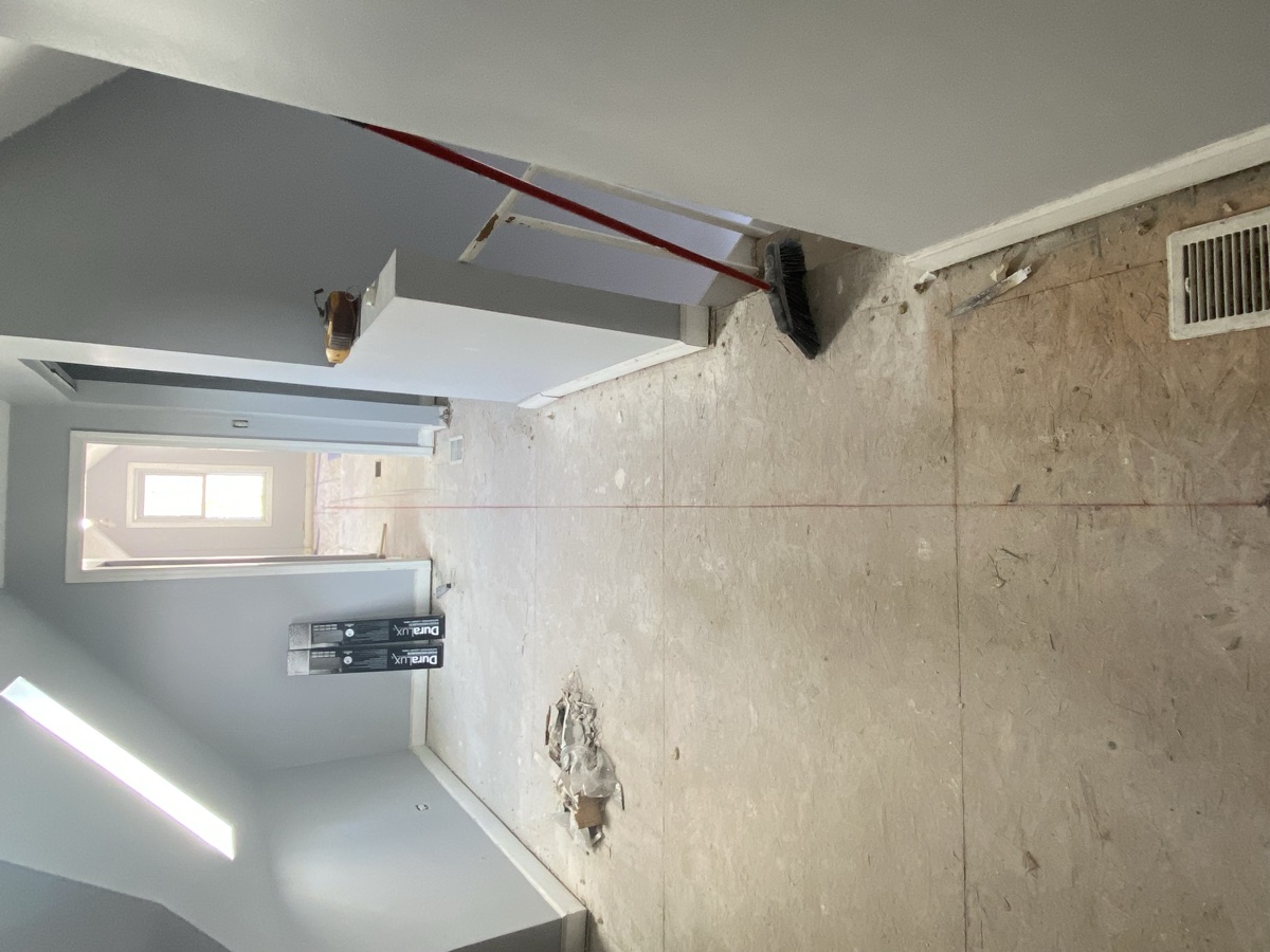 Room before renovation - subfloor and exposed walls